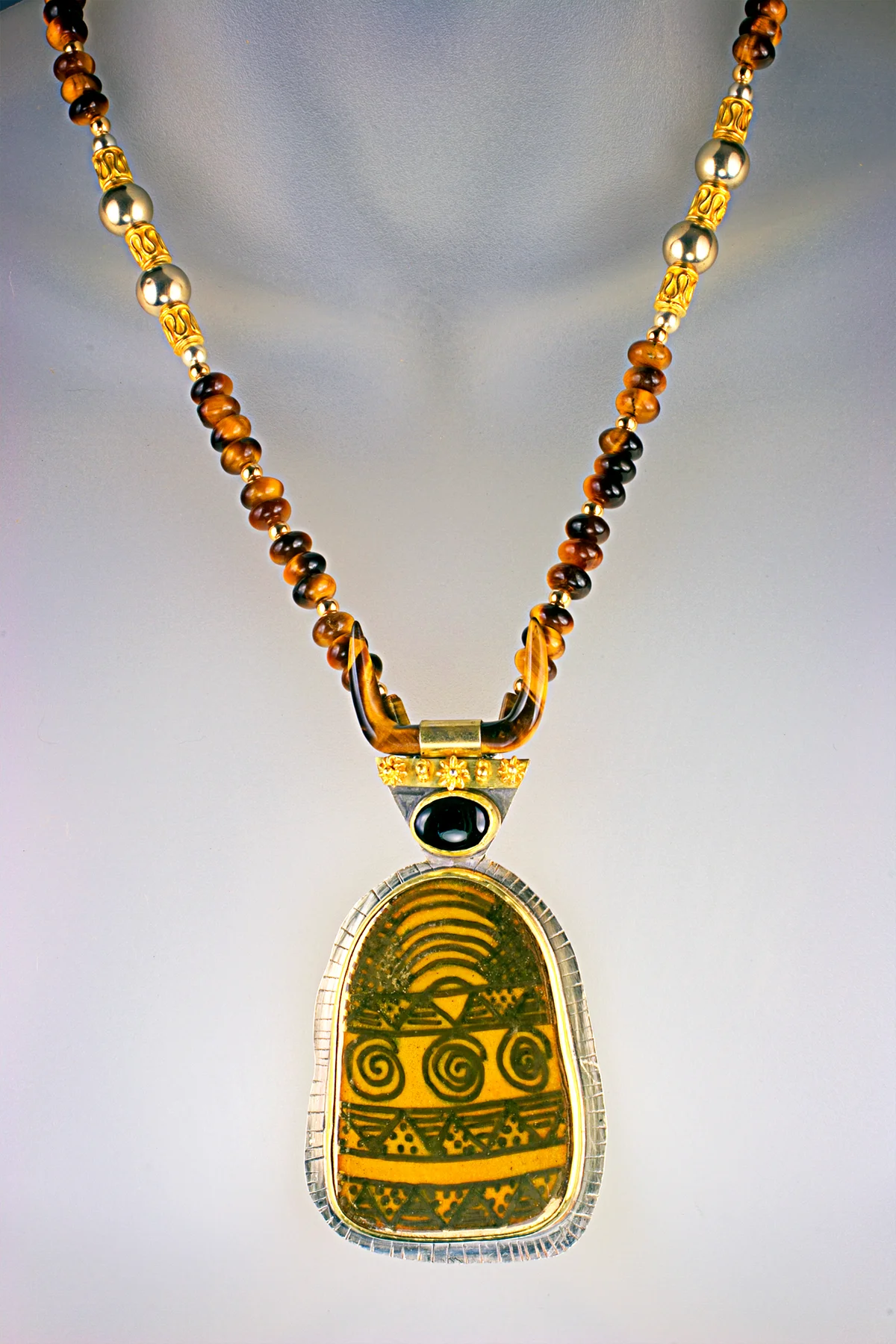 Vitreous enamel embellihsed with 24 kt gold