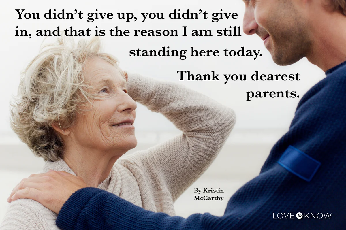 Senior woman and adult son talking on the beach