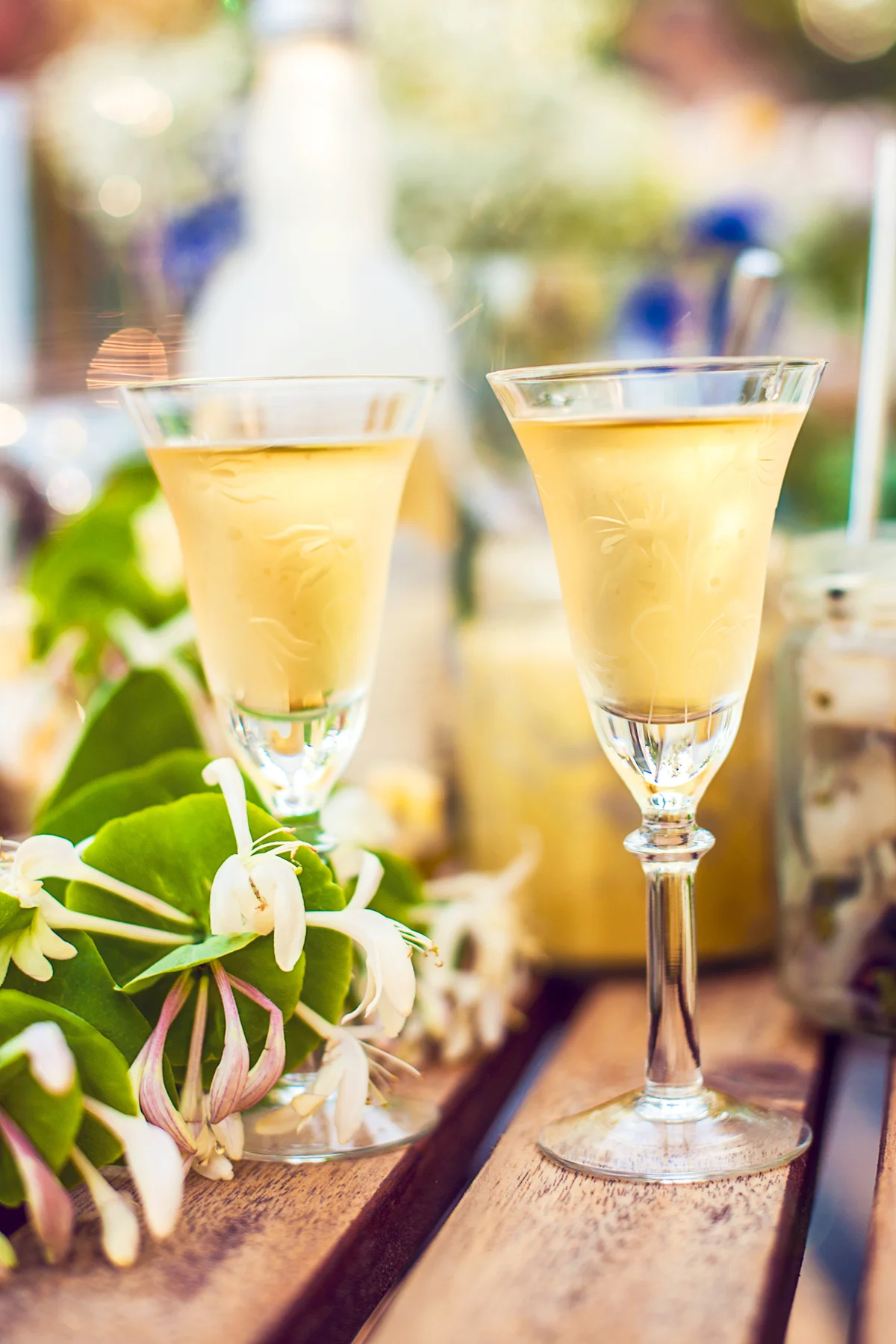 Two honeysuckle cocktails on a table