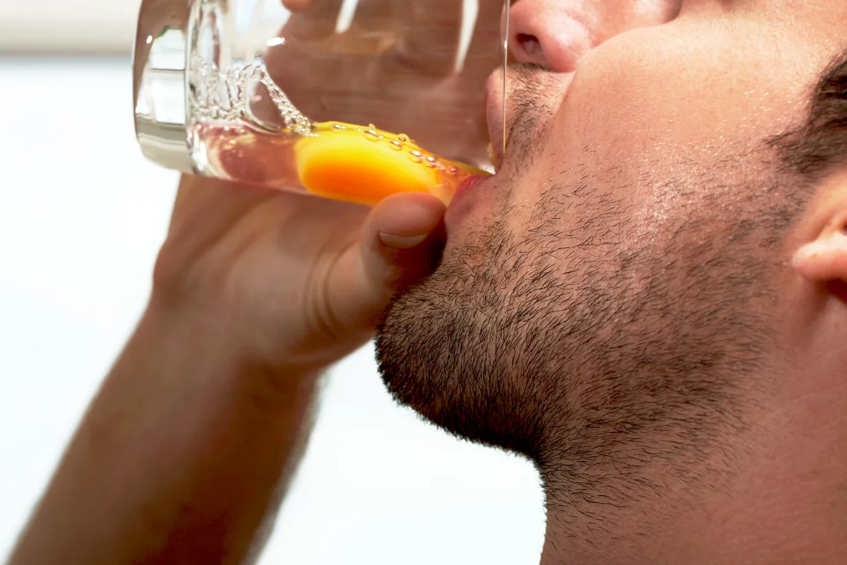 Man drinking Amber Moon