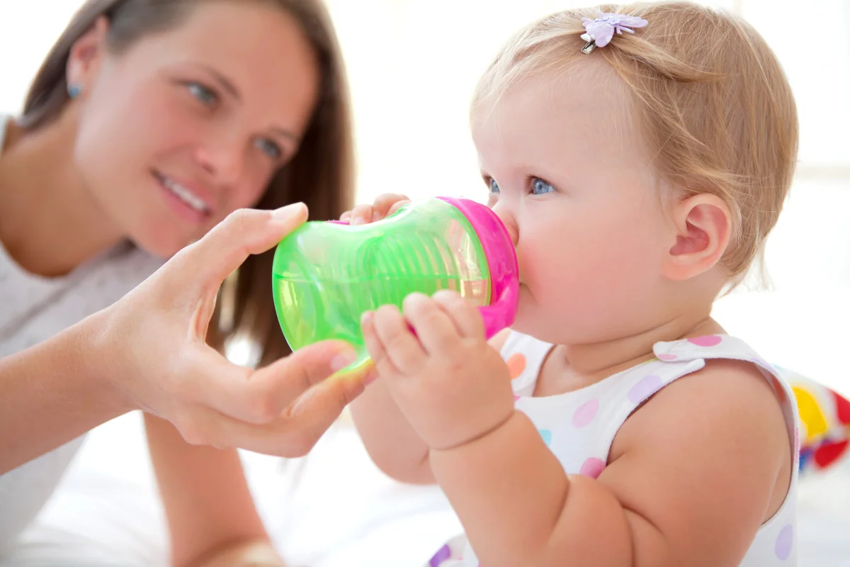 Cute baby drinking water
