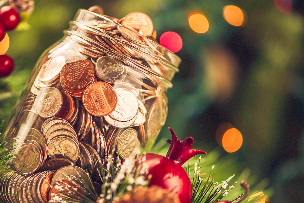 Christmas charity donation jar filled with American currency