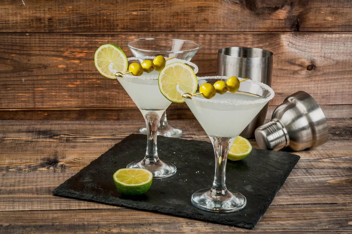 Alcohol cocktail margarita, martini or gin tonic with lime