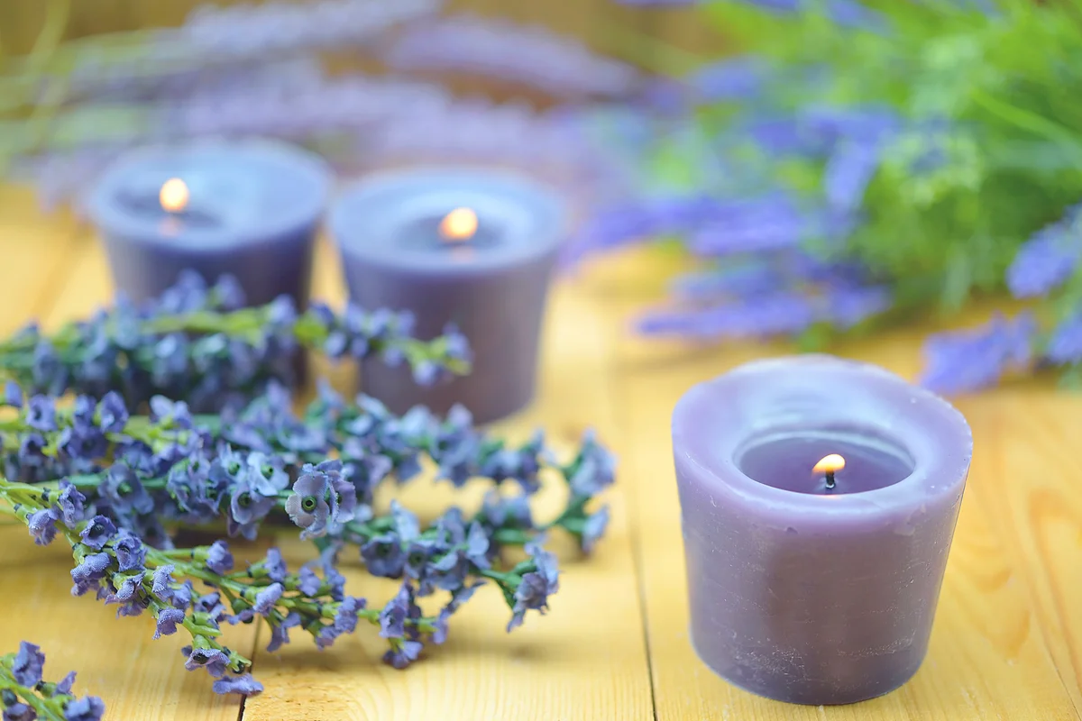 Scented Candles And Lavender On Table