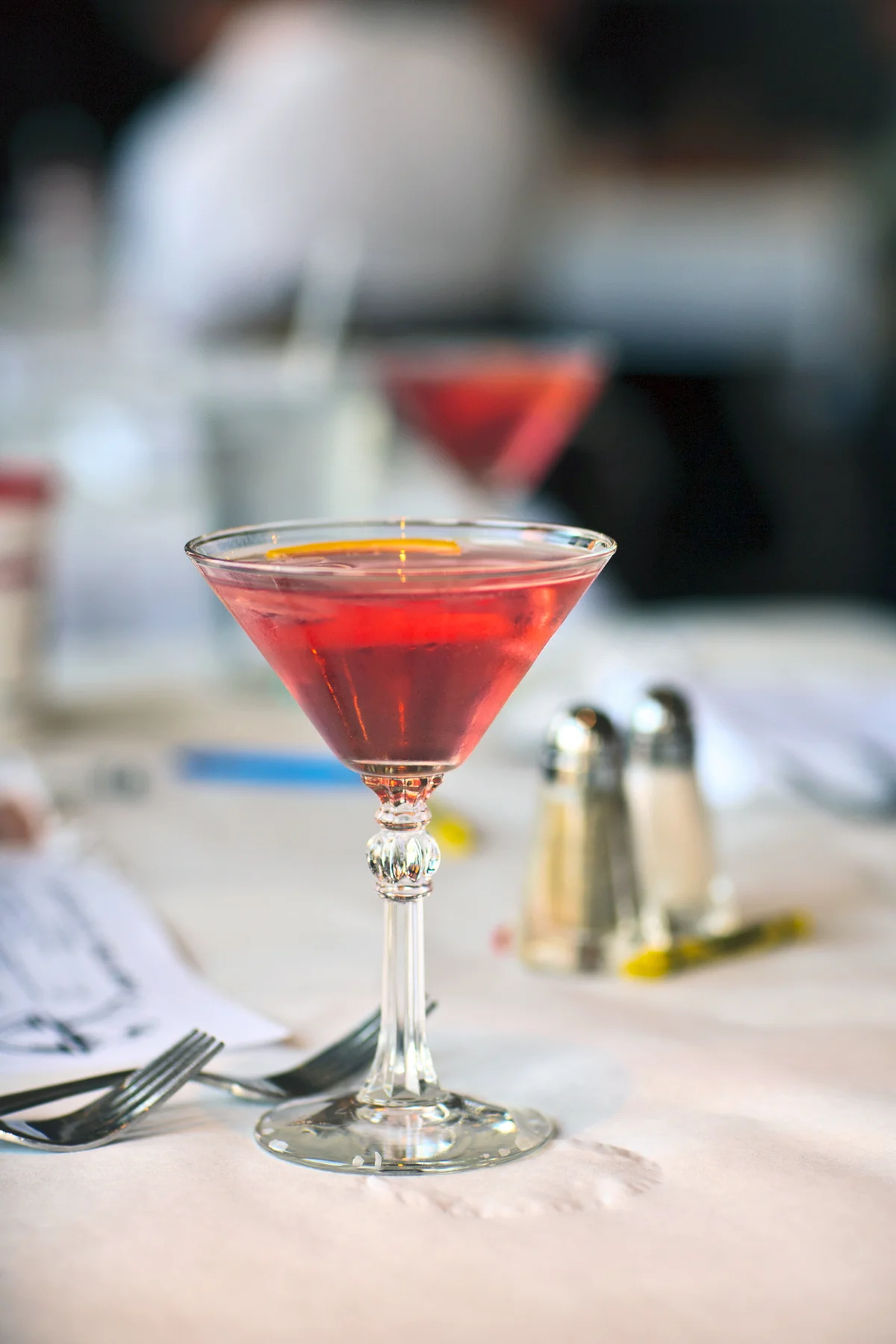 A Cosmopolitan cocktail on a table