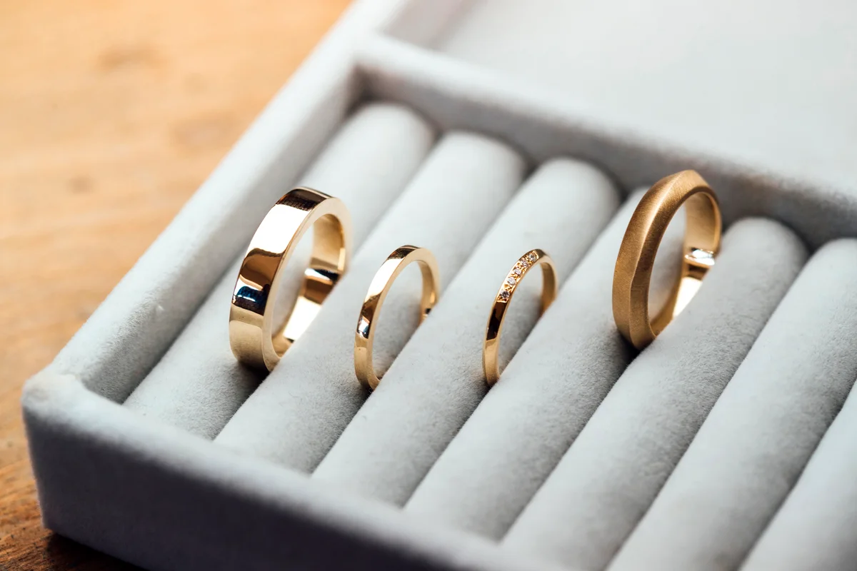 A collection of handcrafted golden rings on display