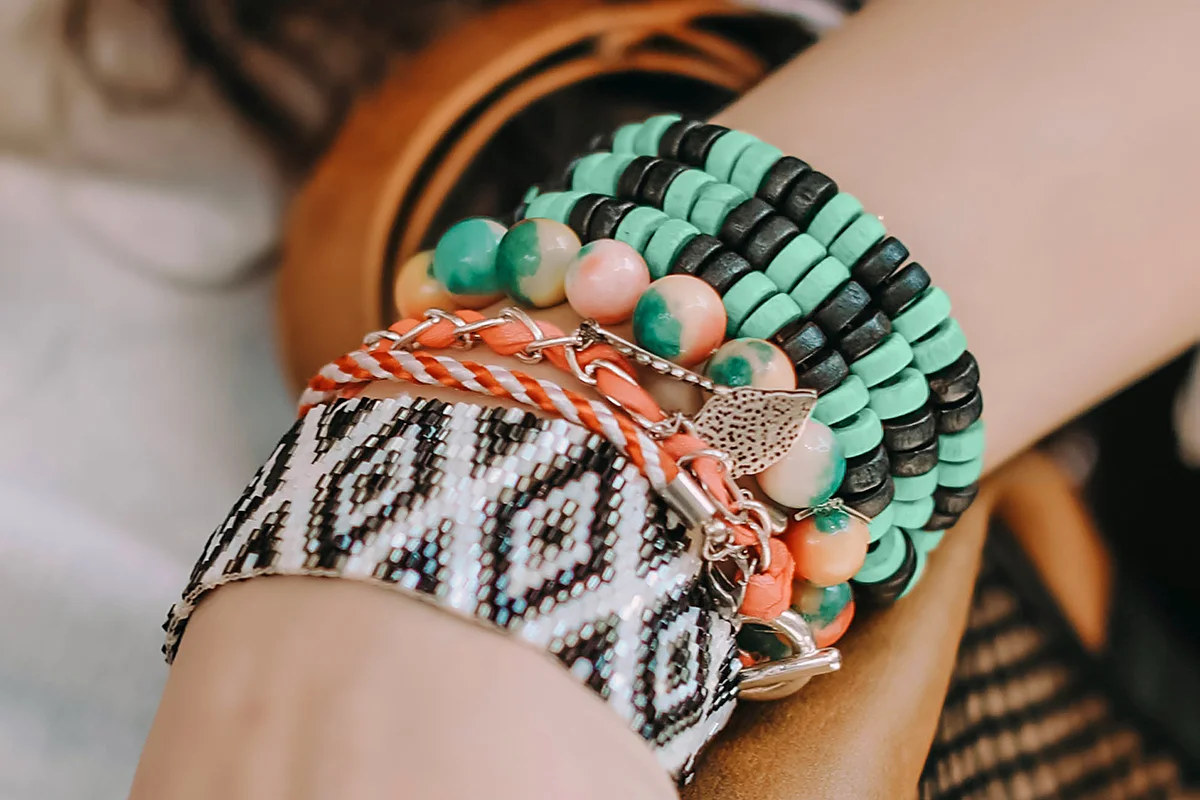Hand with hippy bracelets from beads