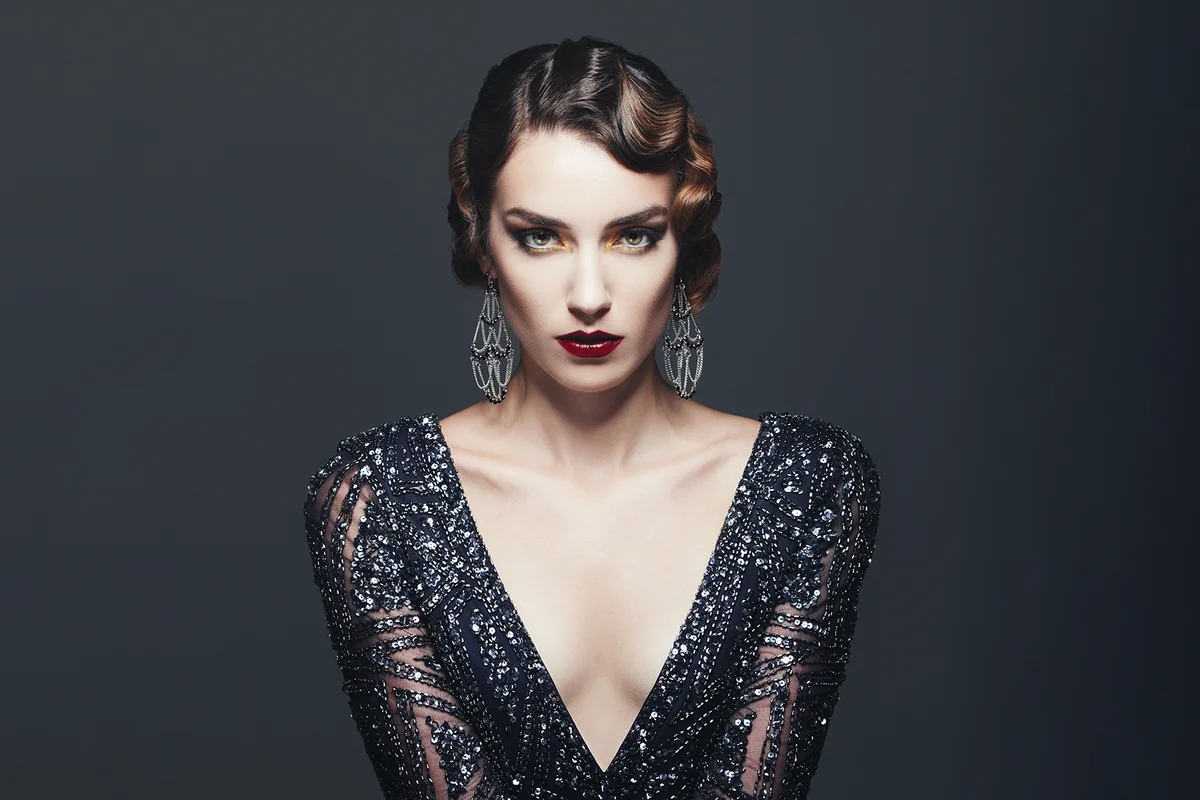 beautiful glamorous woman wearing 20's dress and jewelry
