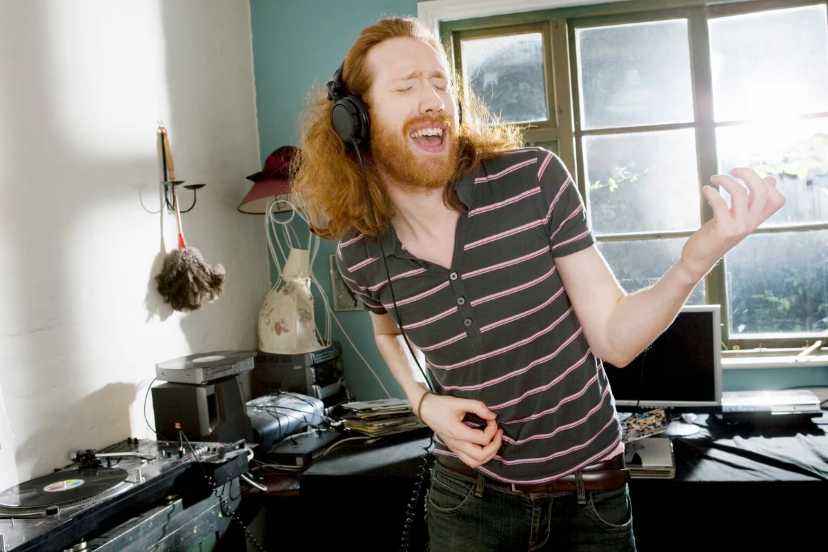 Man playing imaginary guitar