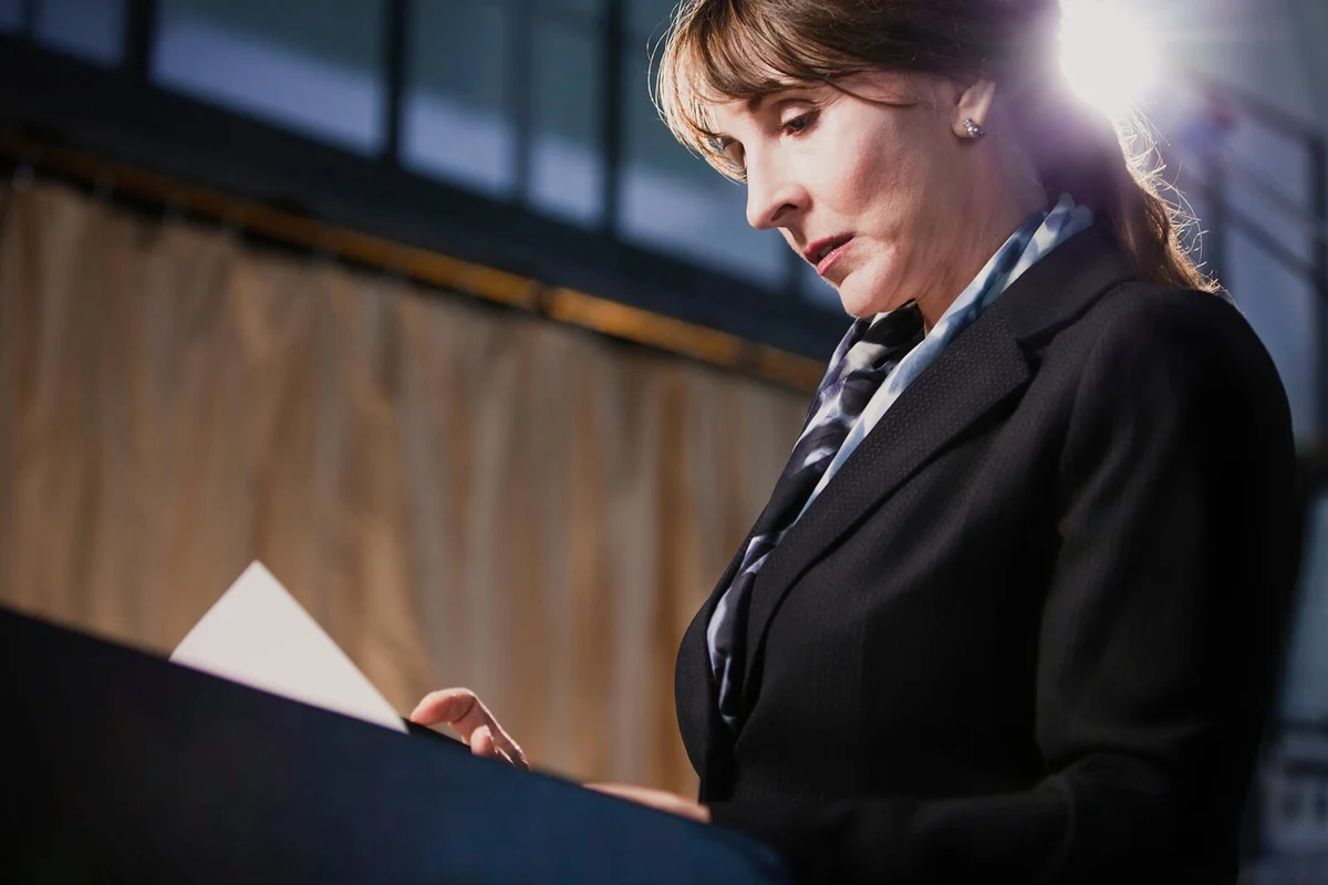 woman reading paperwork