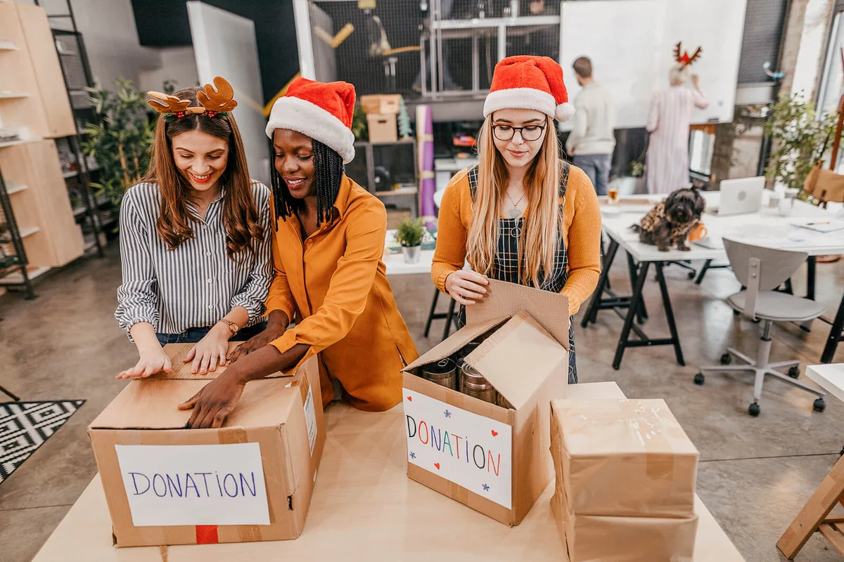 volunteers packing boxes for Christmas donation