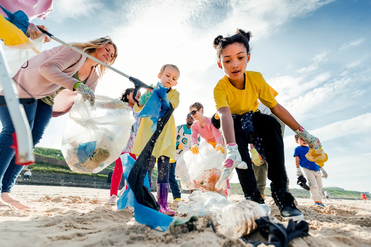 Community Volunteer Groups on the Beach Picking Up Trash