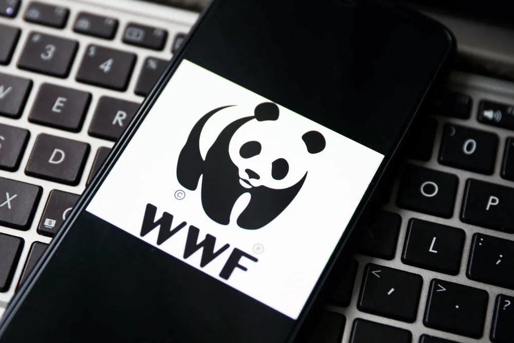 WWF logo is displayed on a mobile phone screen