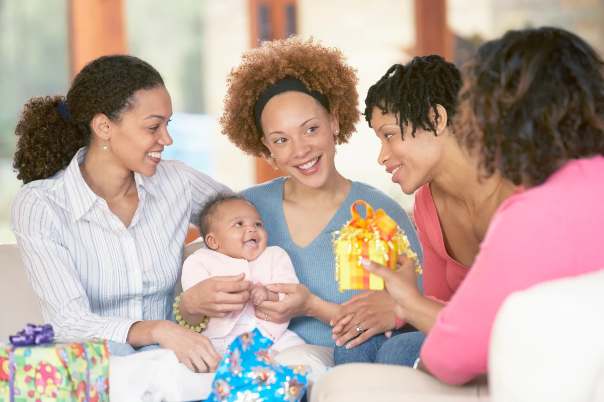 Mother and baby with friends at sip and see baby party