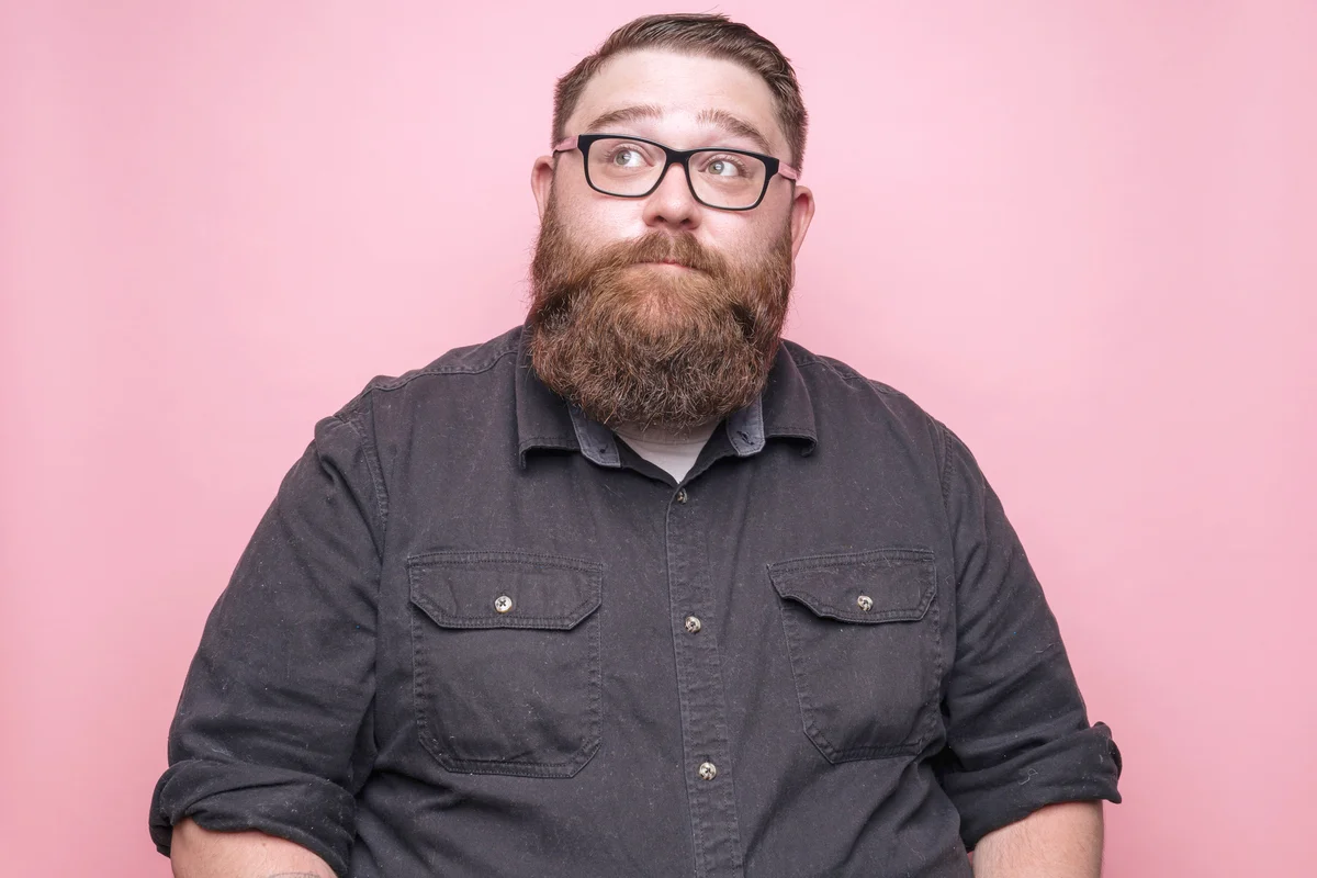 Bearded man on pink background