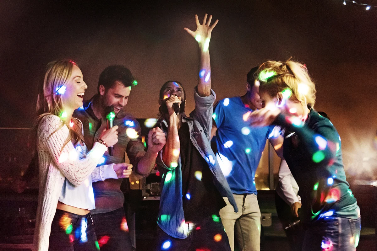 Group of friends doing karaoke