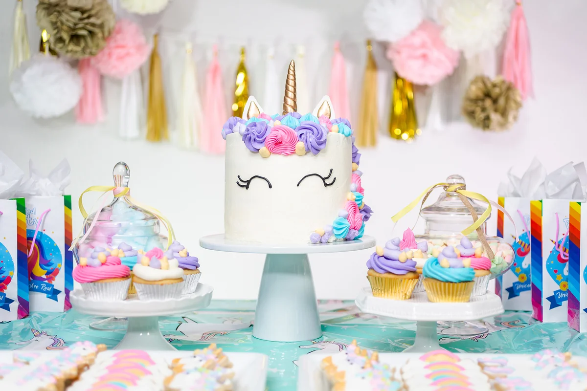 party table with unicorn cake
