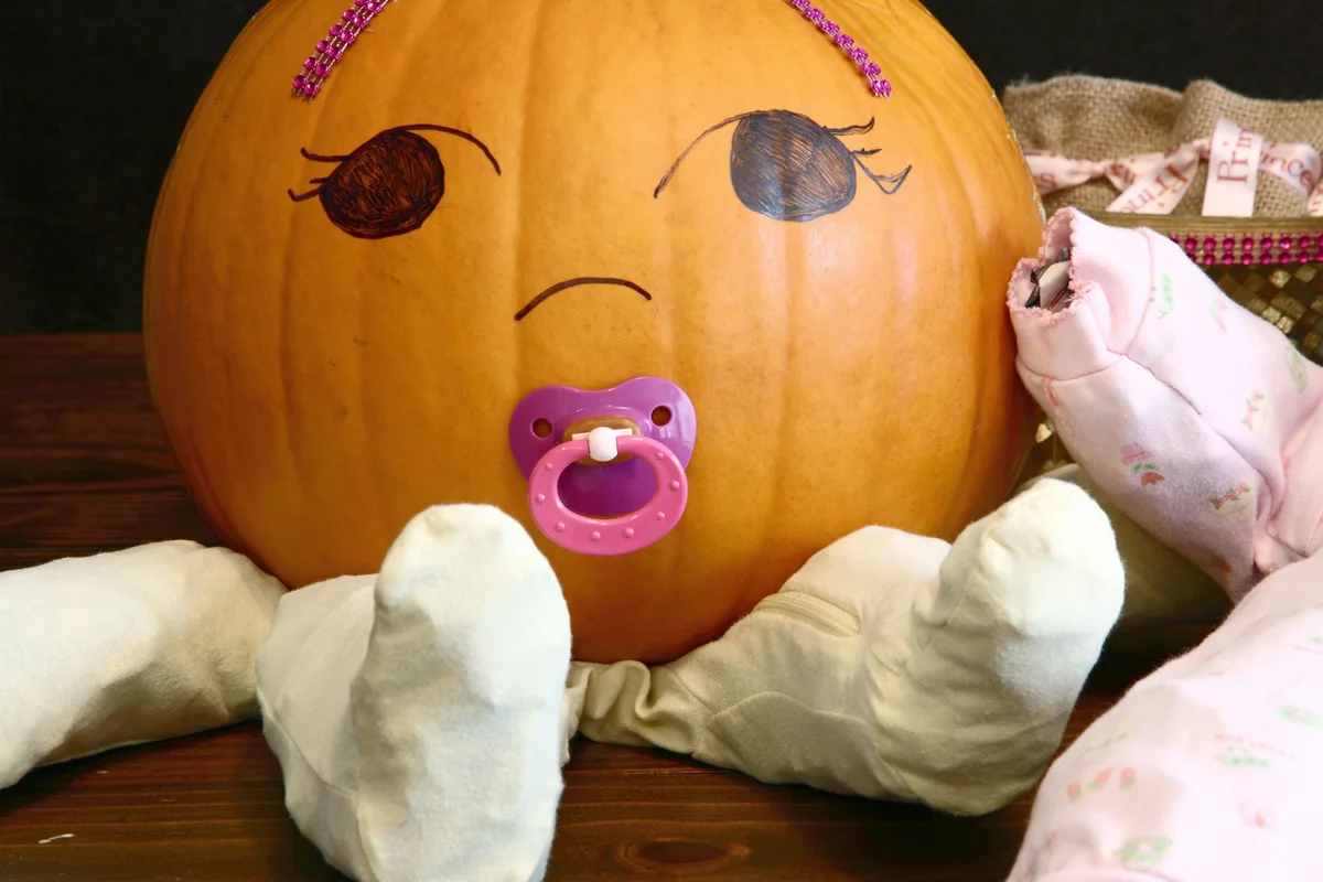 Pumpkin baby with pacifier