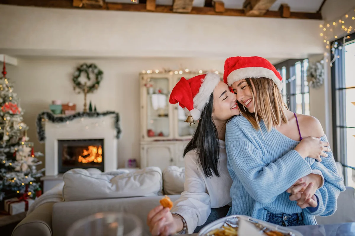 Girlfriends eating delivered food in the kitchen for Christmas day