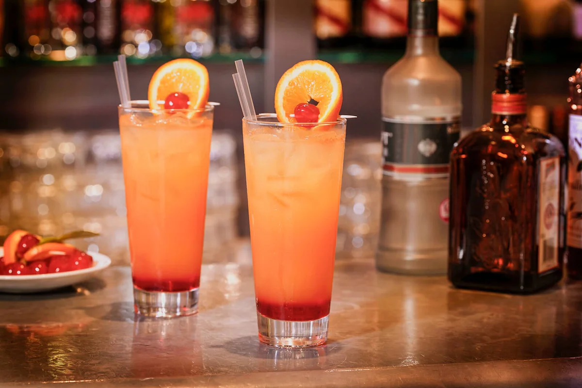 Easy rider cocktails with rum and passion fruit syrup on bar counter