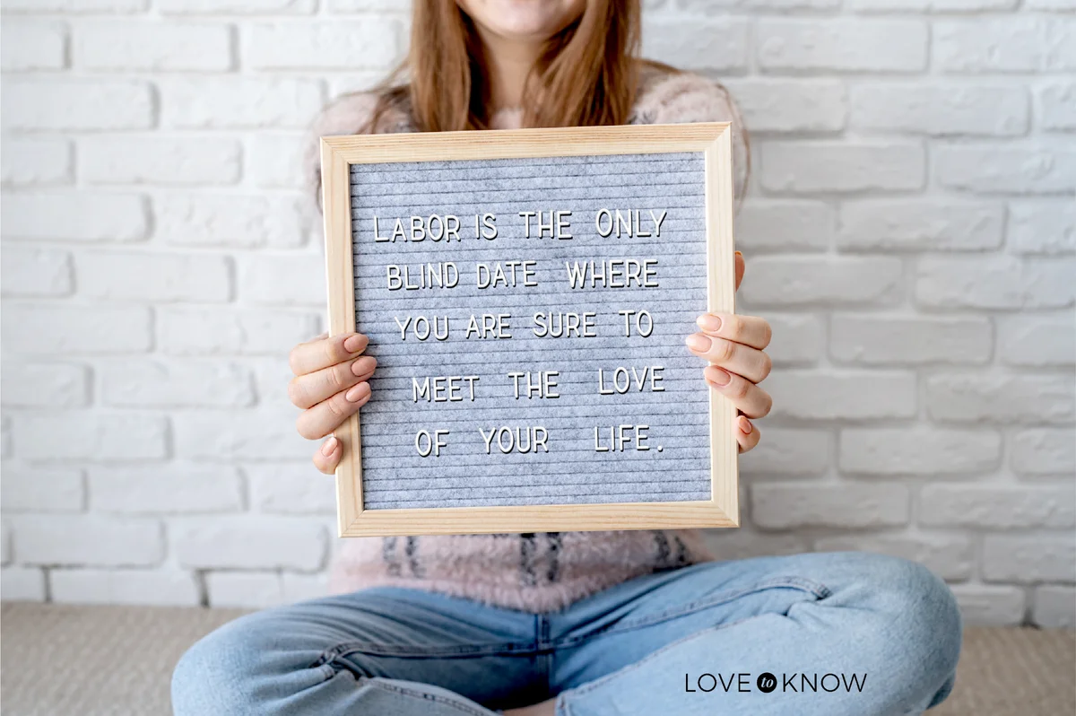 Woman holding felt letter board