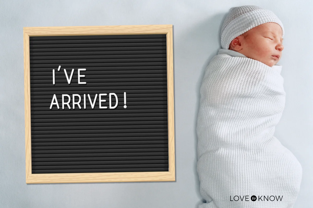 New born baby with letter board