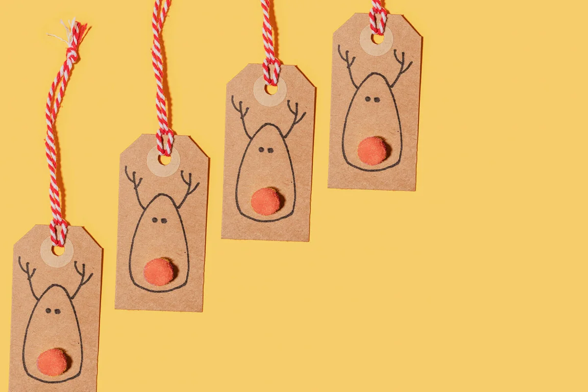 Santa Claus reindeer label for Christmas gift on yellow background