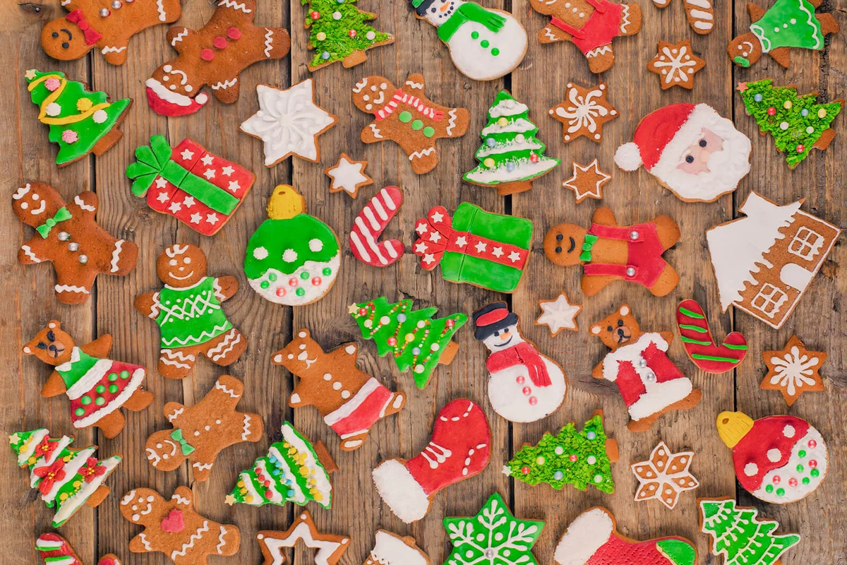 Delicious beautiful Christmas gingerbread cookies on wooden table
