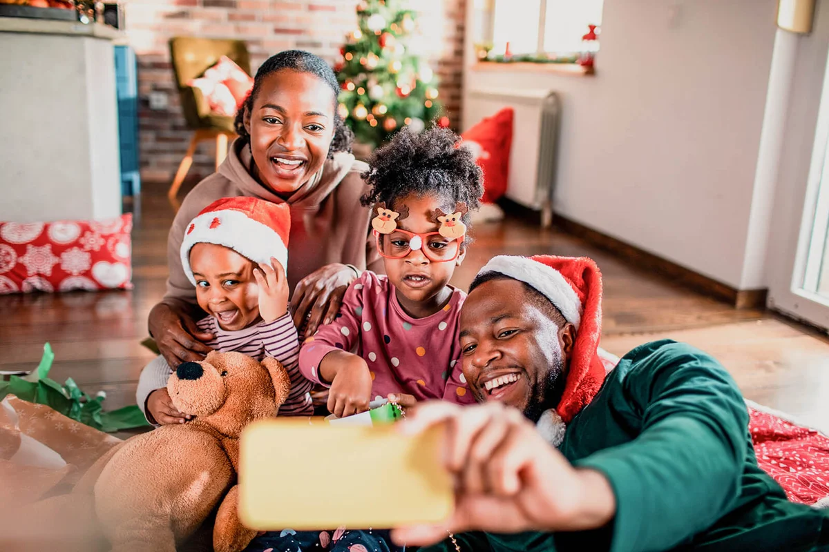 Young family taking a selfie during Christmas