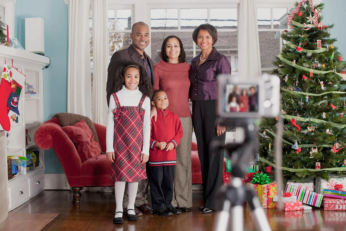 Family taking Holiday portrait with digital camera