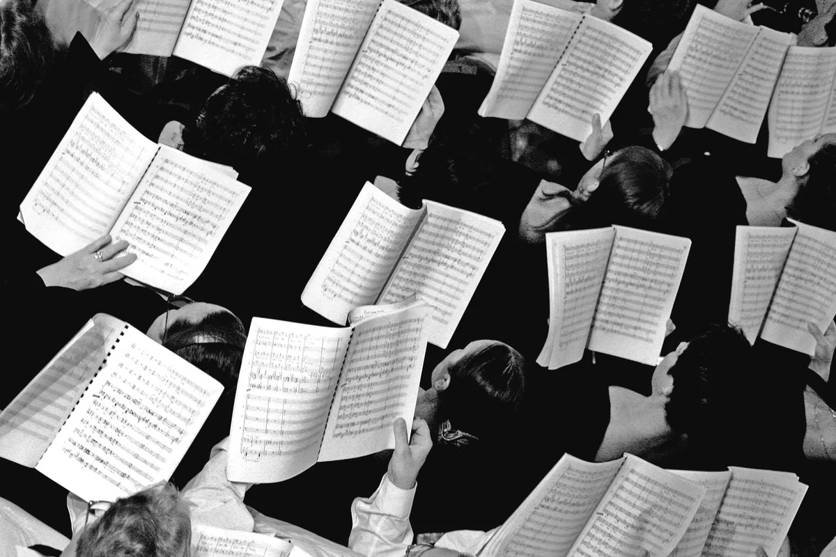 Choir with notes in hands,