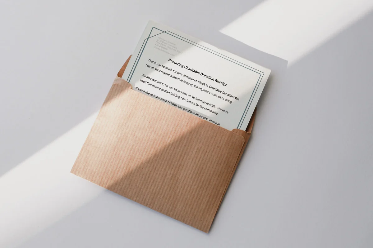 Brown envelope with white blank paper card