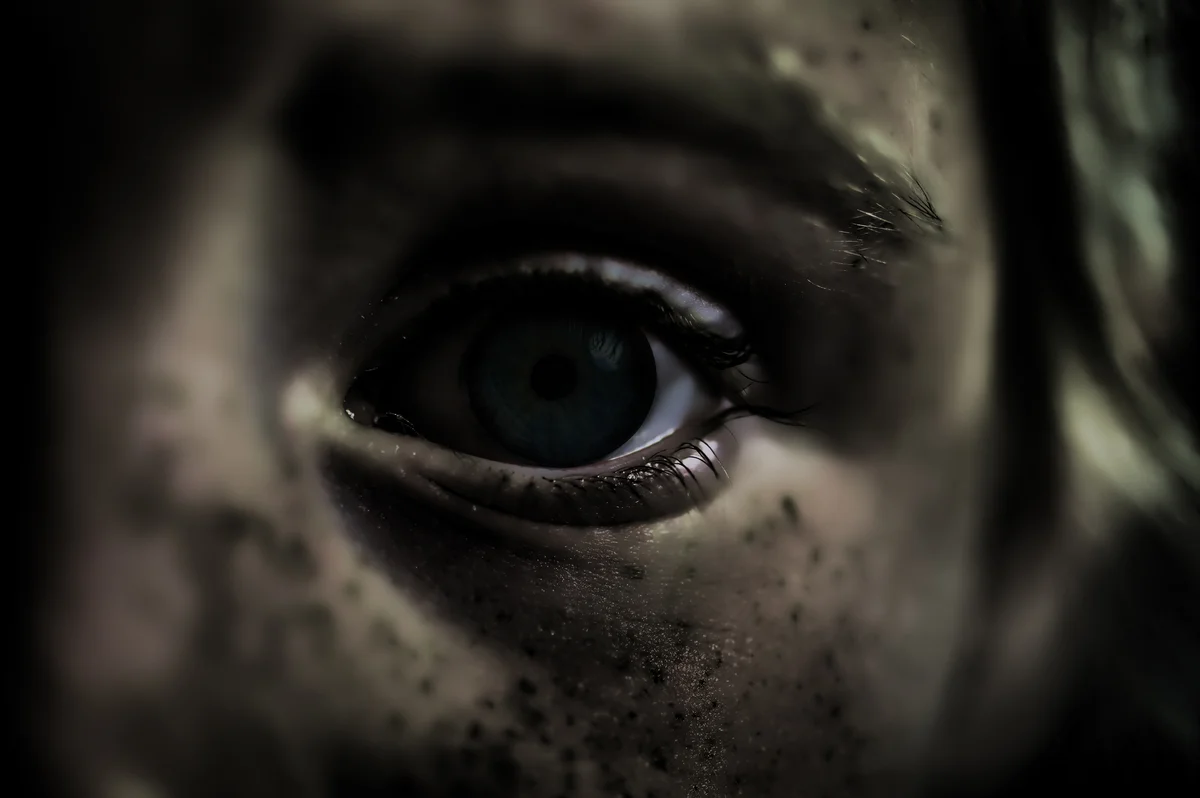 Scary girl with black eyes