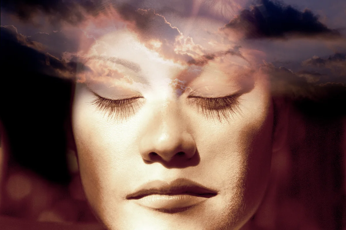Woman's face and sky