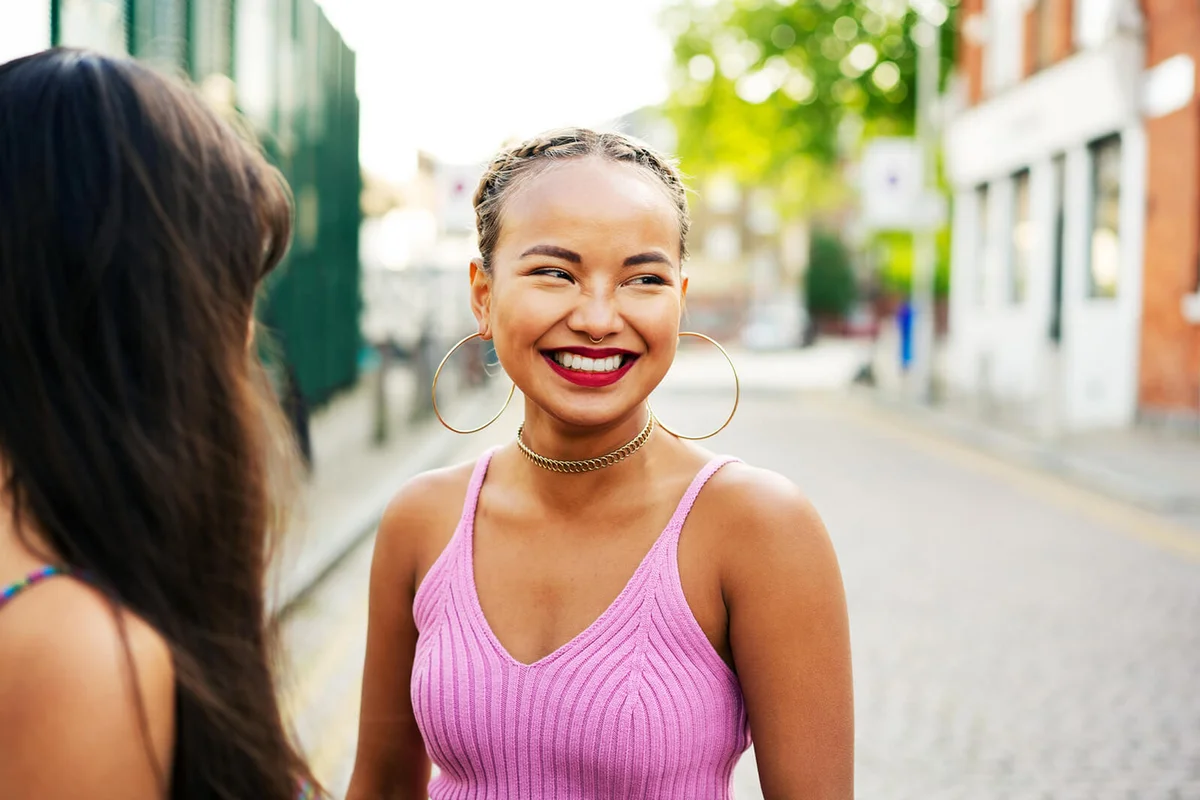young woman wearing pink top
