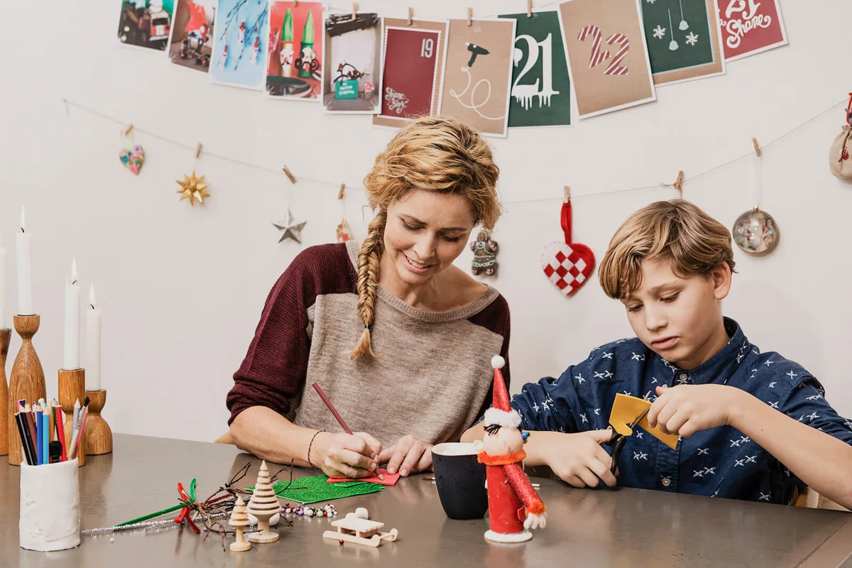 Mother and son making X mas decorations
