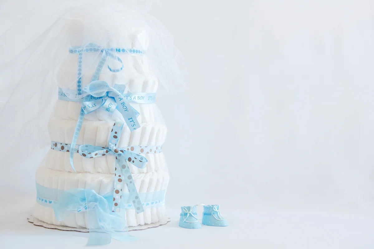 Diaper Cake and baby boy shoes for a baby shower