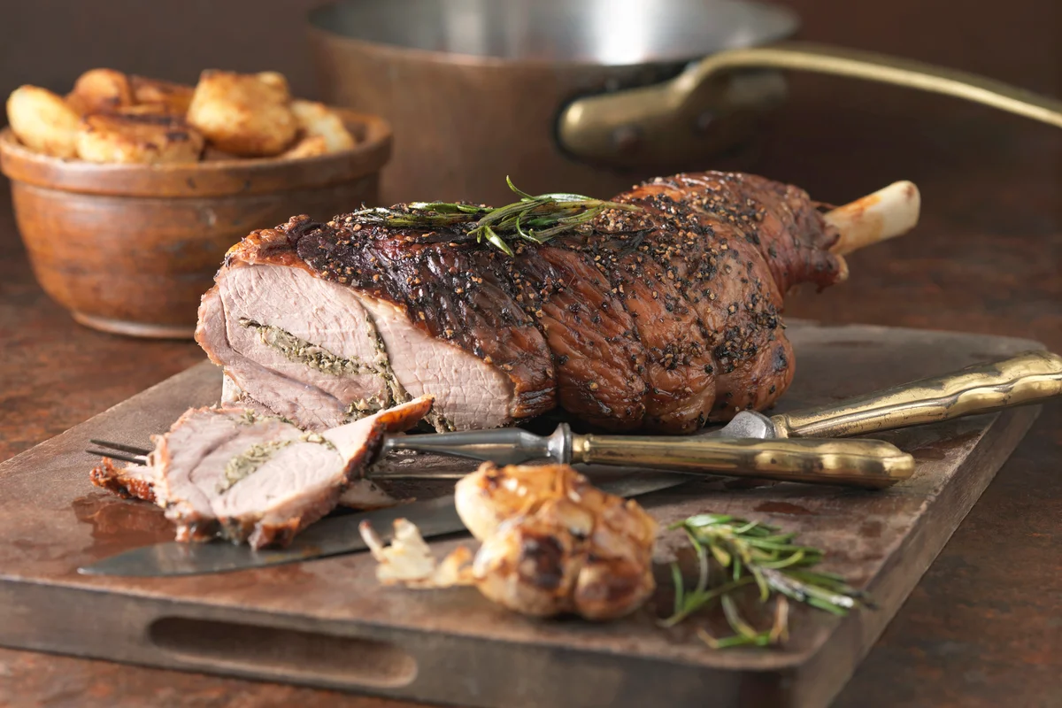 Roasted rosemary and garlic leg of lamb and roast potatoes
