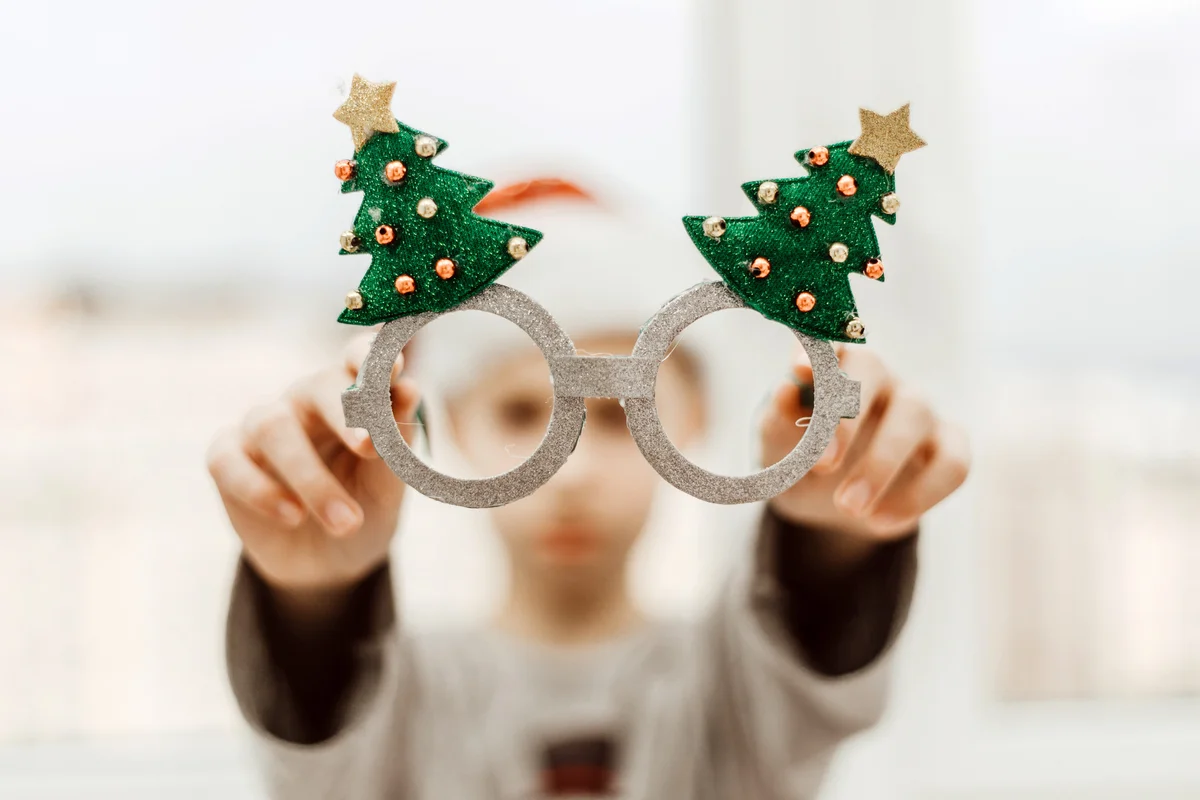 Boy with santa hat and funny xmas glasses