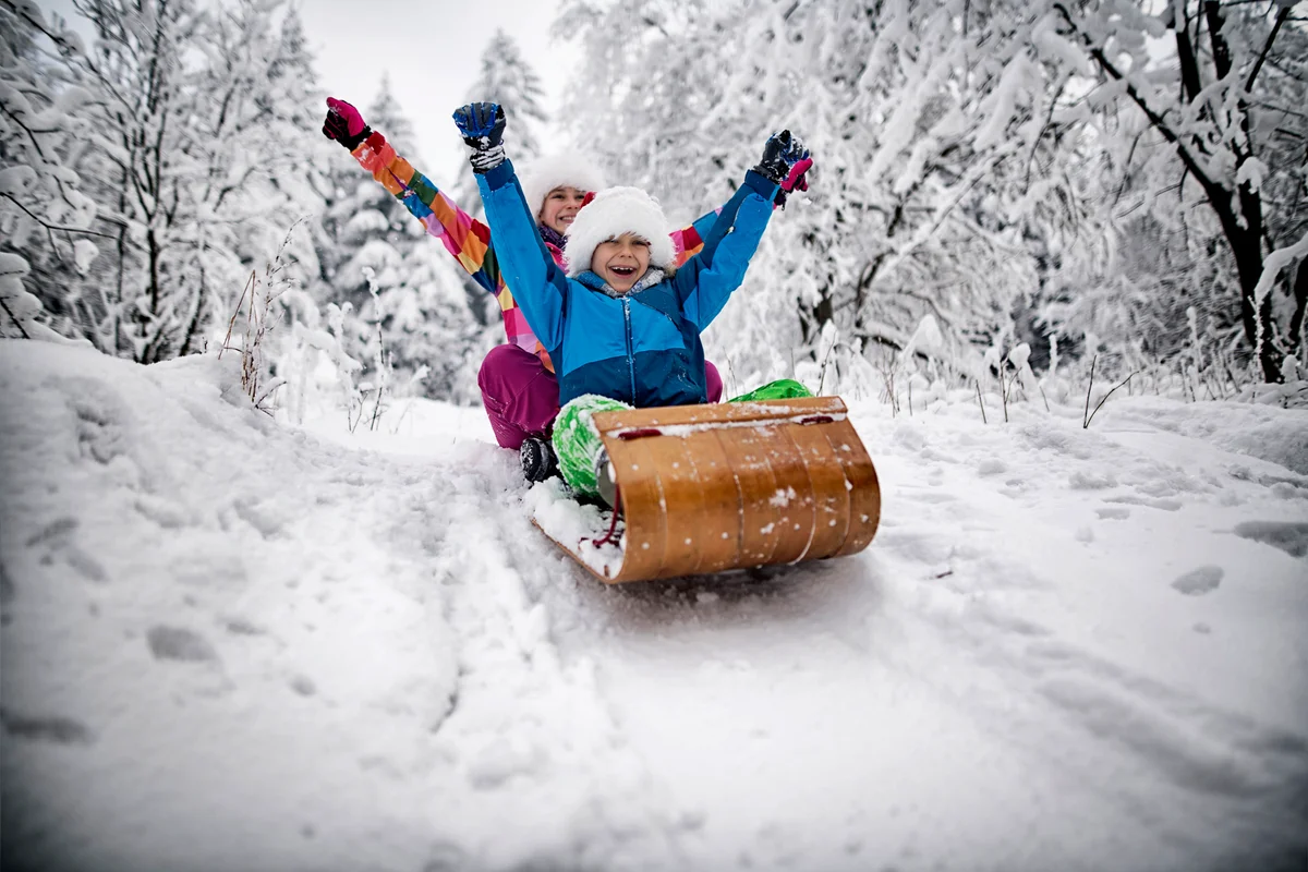 Kids tobogganing on Christmas