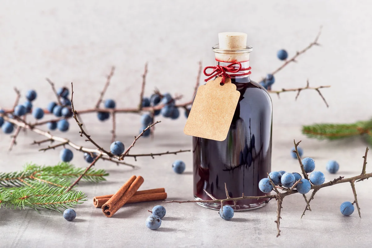 Homemade sloe liquor in a glass bottle
