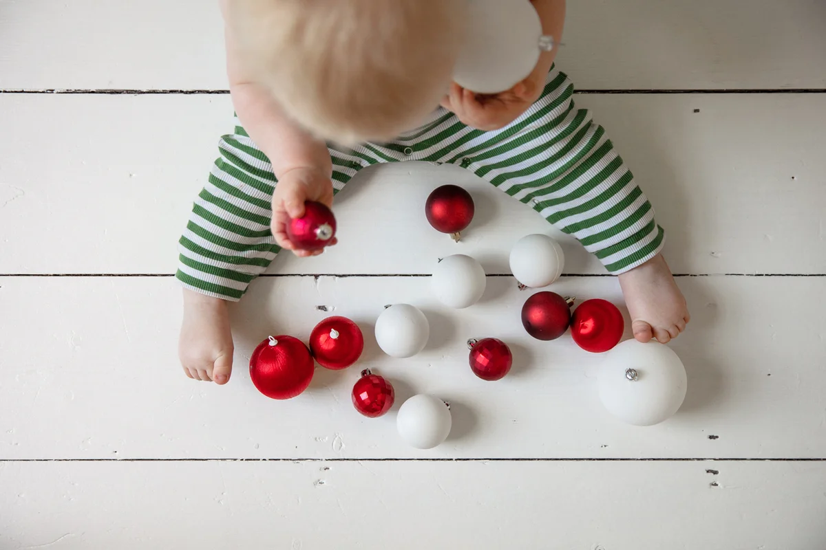 High Angle View Of Baby Playing With Ball On Floor