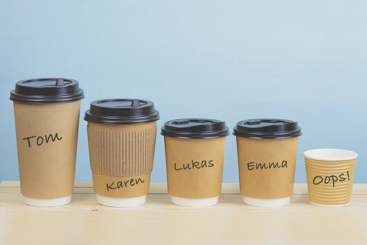 Paper coffee cups on a wooden table