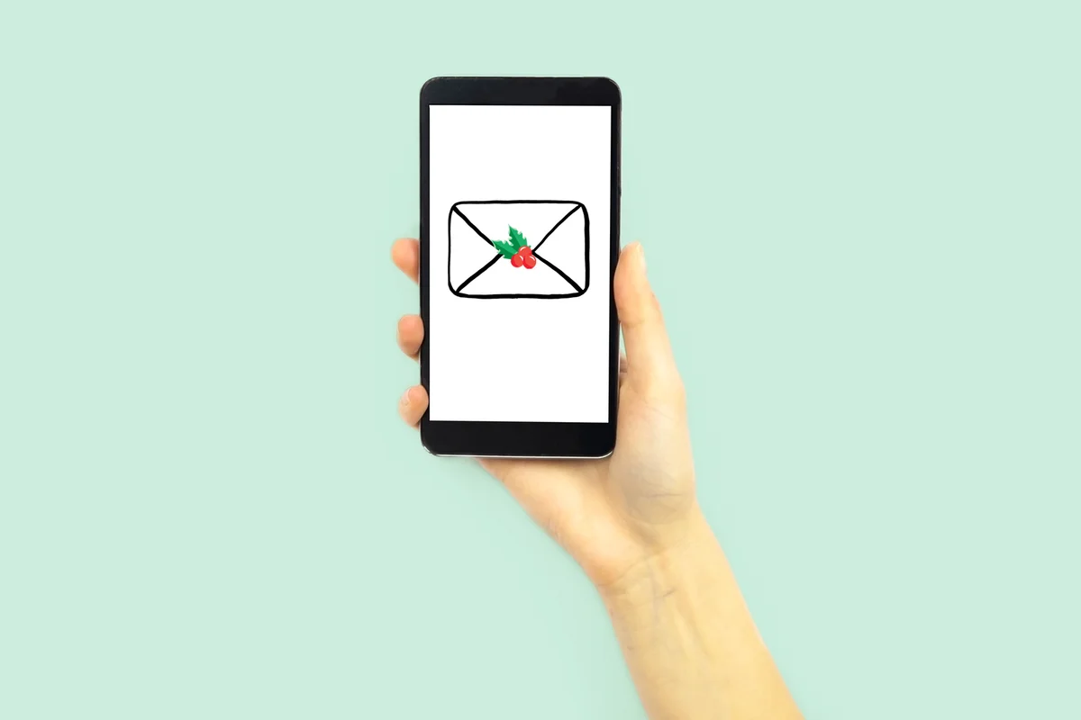 Hand holding a phone with e-card