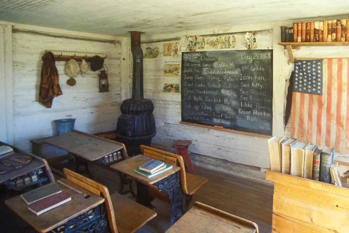 Interior of the first one room schoolhouse in MT, NV City with a potbelly stove