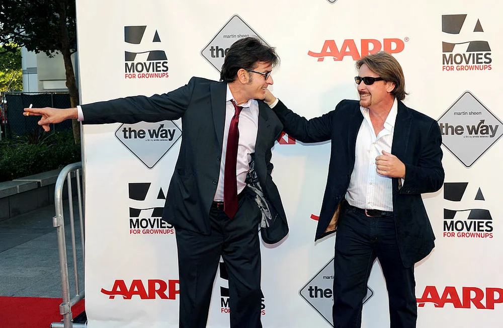 Actor Charlie Sheen and director Emilio Estevez attend AARP's Movies For Grown Ups Film Festival