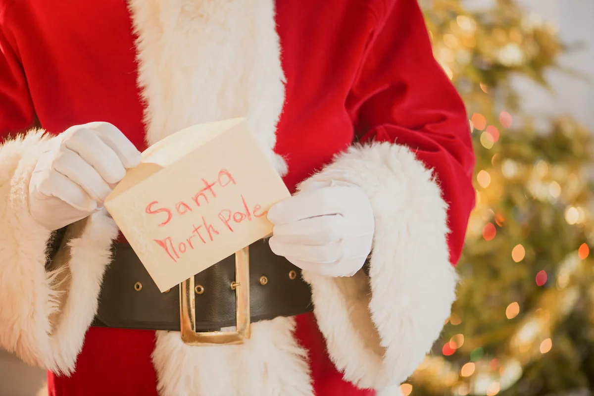Santa claus holding letter