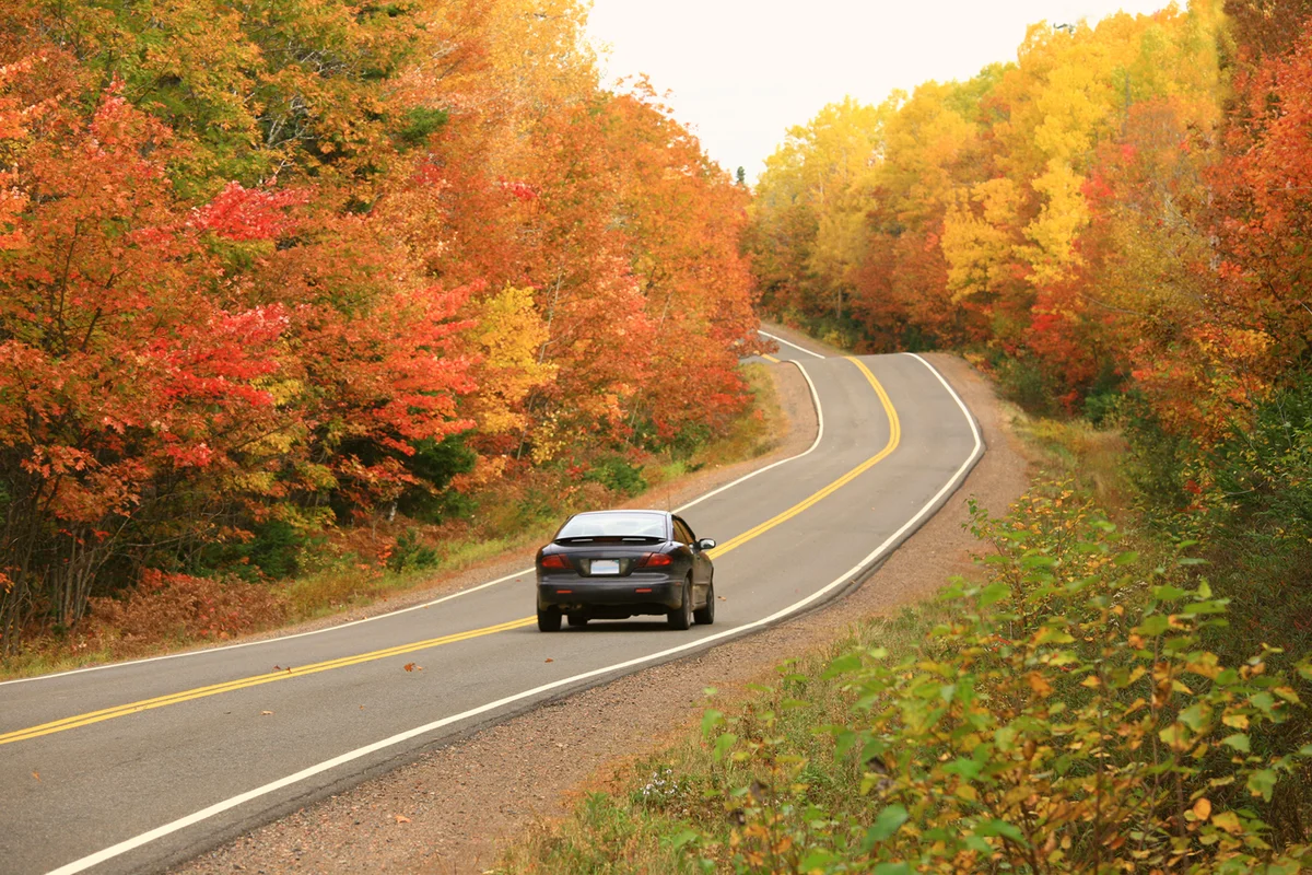 Car Driving on Remote Appalachian Highway in Fall