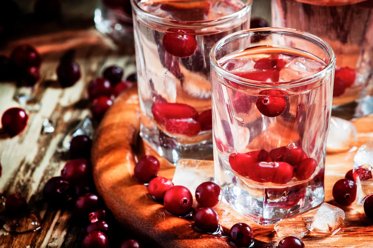 Close-up of glasses with water and cranberries