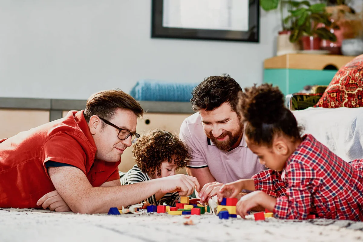 diverse family playing on floor
